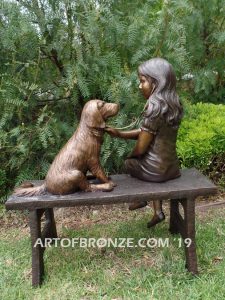 Checkup bronze sculpture of seated veterinarian girl and dog on bench with girl holding stethoscope