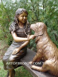 Checkup bronze sculpture of seated veterinarian girl and dog on bench with girl holding stethoscope