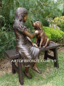 Checkup bronze sculpture of seated veterinarian girl and dog on bench with girl holding stethoscope