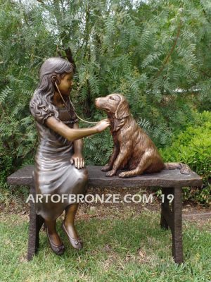 Checkup bronze sculpture of seated veterinarian girl and dog on bench with girl holding stethoscope