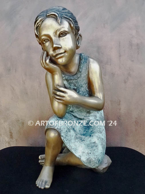 Cutie Pie bronze sculpture of girl sitting down and daydreaming