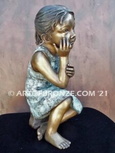 Cutie Pie bronze sculpture of girl sitting down and daydreaming