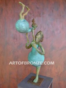 Maternidad bronze gallery sculpture of mother swinging daughter on steel pedestal