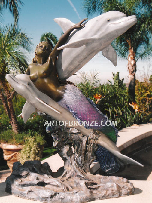 Neptunes Delight Bronze statue of mermaid swimming with two dolphins for pool or water feature