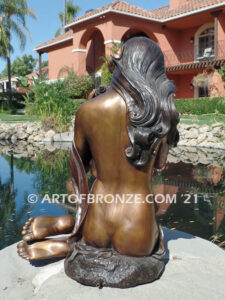 Illusion bronze sculpture of exotic nude woman listening to shell for private gallery or public display