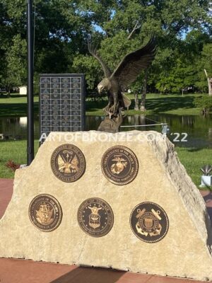 Southern Lyon County All Veterans Eagle war Memorial outdoor monumental statue of an eagle landing atop stone pillar