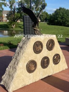 Southern Lyon County All Veterans Eagle war Memorial outdoor monumental statue of an eagle landing atop stone pillar