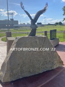 Southern Lyon County All Veterans Eagle war Memorial outdoor monumental statue of an eagle landing atop stone pillar