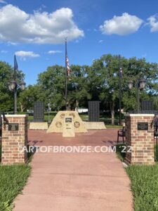 Southern Lyon County All Veterans Eagle war Memorial outdoor monumental statue of an eagle landing atop stone pillar