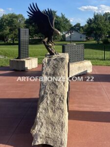 Southern Lyon County All Veterans Eagle war Memorial outdoor monumental statue of an eagle landing atop stone pillar