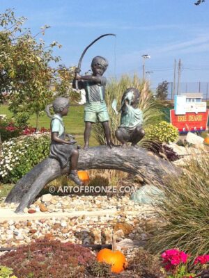 Fun Day outdoor bronze statue of three kids playing on huge bronze arched log