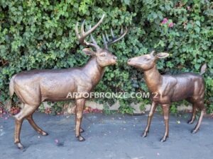 Morning Encounter outdoor monumental bronze buck and doe standing sculptures