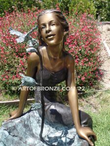 Beautiful Hummingbird bronze sculpture of adorable young girl & hummingbird public artwork