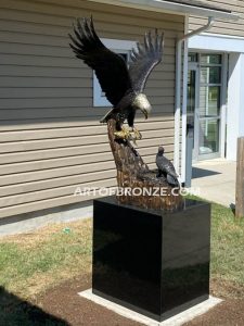 Eagle outdoor monumental statue of eagle landing in nest to baby eaglet