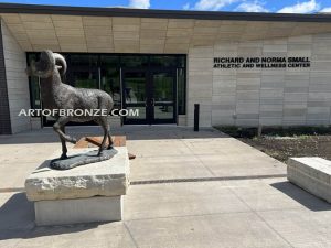 Cornell College outdoor monumental statue of big horn sheep attached to rock pedestal