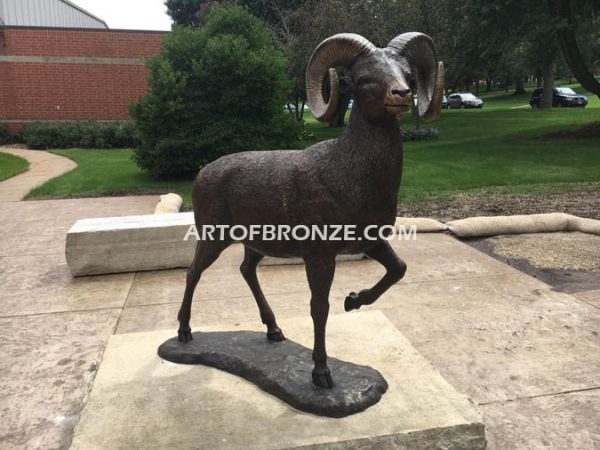 Cornell College outdoor monumental statue of big horn sheep attached to rock pedestal