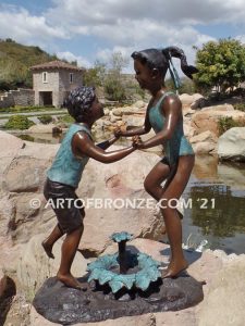 Dance Around bronze sculpture of boy & girl holding hands and playing together