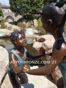 Dance Around bronze sculpture of boy & girl holding hands and playing together