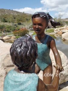 Dance Around bronze sculpture of boy & girl holding hands and playing together