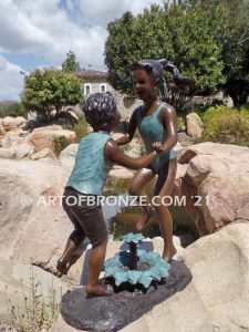 Dance Around bronze sculpture of boy & girl holding hands and playing together