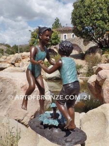 Dance Around bronze sculpture of boy & girl holding hands and playing together