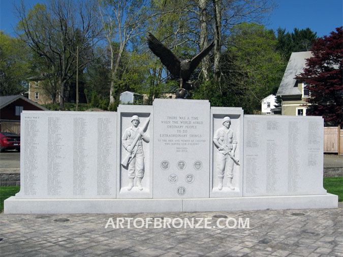 Eagle Veteran Memorial outdoor monumental sculpture of an eagle landing atop granite pillar