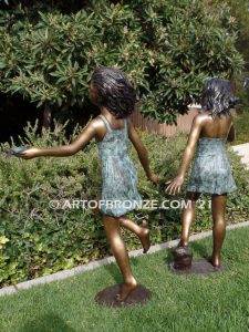 Exploring Nature bronze sculpture of young girls with seashell and sea turtle