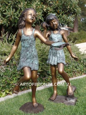 Exploring Nature bronze sculpture of young girls with seashell and sea turtle