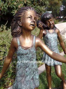 Exploring Nature bronze sculpture of young girls with seashell and sea turtle