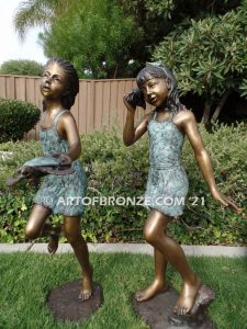 Exploring Nature bronze sculpture of young girls with seashell and sea turtle