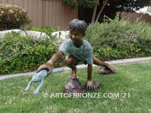 Frog Catching outdoor bronze fountain statue of boy grasping bullfrog that can spray water