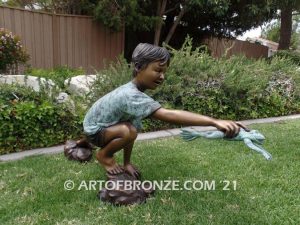 Frog Catching outdoor bronze fountain statue of boy grasping bullfrog that can spray water