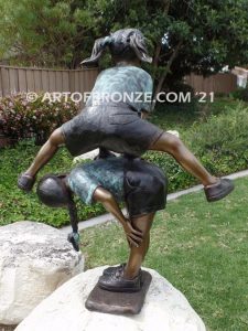 Leap Frog garden bronze sculpture of girl vaulting over crouched girl