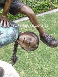 Leap Frog garden bronze sculpture of girl vaulting over crouched girl