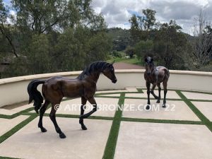 Legacy and Legend San Marcos home bronze sculpture pair of standing right left horse pair