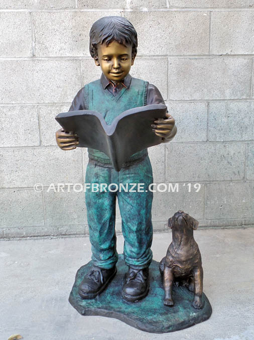 Waiting for Attention bronze sculpture of young boy reading his favorite novel