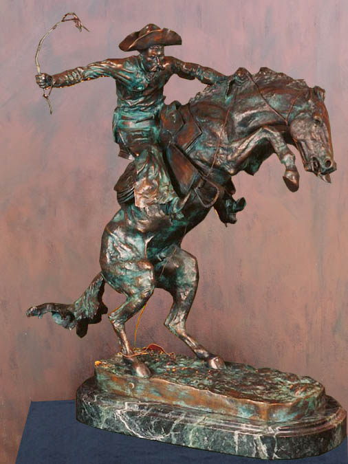 Bronco Buster indoor bronze statue of cowboy on rearing horse