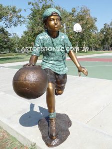 Fast Break bronze sculpture of basketball player dribbling ball and running