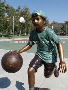Fast Break bronze sculpture of basketball player dribbling ball and running