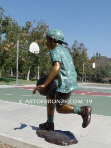 Fast Break bronze sculpture of basketball player dribbling ball and running