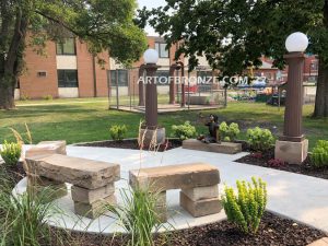 Mayville Statue University outdoor bronze statue butterfly girl sitting down on stone ledge