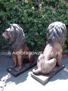 Kings of the Castle high quality cast bronze African lion pair sitting next to each other