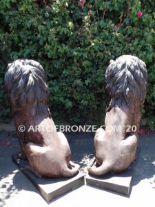 Kings of the Castle high quality cast bronze African lion pair sitting next to each other