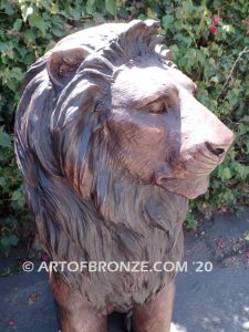 Kings of the Castle high quality cast bronze African lion pair sitting next to each other