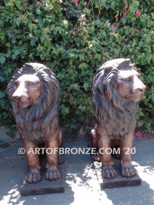 Kings of the Castle high quality cast bronze African lion pair sitting next to each other