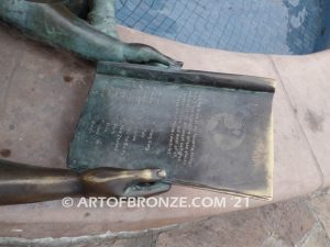 Early Comprehension bronze sculpture of young girl reading her favorite novel