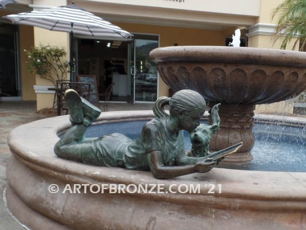 Early Comprehension bronze sculpture of young girl reading her favorite novel
