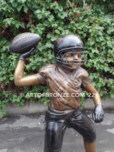 Quarterback Leader bronze sculpture of football boy wearing helmet, pads and jersey