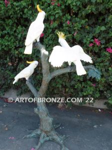 Ready to Entertain outdoor statue of life-size white and yellow crested feathered cockatoos