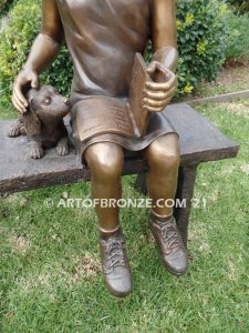 Study Buddy bronze sculpture of seated girl playing with her dog